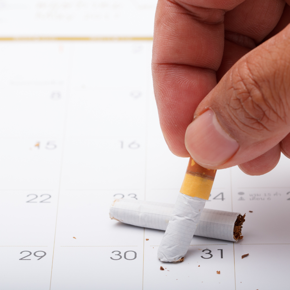 Cigarette écrasée sur un calendrier